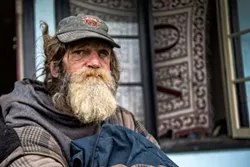 Guy Anderson in front of Eureka’s now defunct Blue Heron hotel in 2015. - PHOTO BY MARK MCKENNA