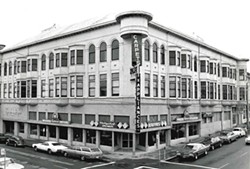 It’s unclear why, but at some point near the middle of the 20th century, the ornate exterior of the Carson Block building was covered with stucco and the turret jutting out at the corner of F and Third streets was lopped off to make way for a large neon sign. - PHOTO COURTESY OF THE NORTHERN CALIFORNIA INDIAN DEVELOPMENT COUNCIL
