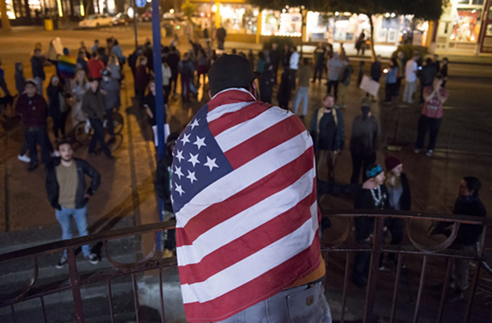 A pro-Trump counter protester at the Old Town gazebo on Thursday evening. - MARK MCKENNA