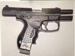 A police photograph of the replica handgun reportedly found on McClain. - THADEUS GREENSON