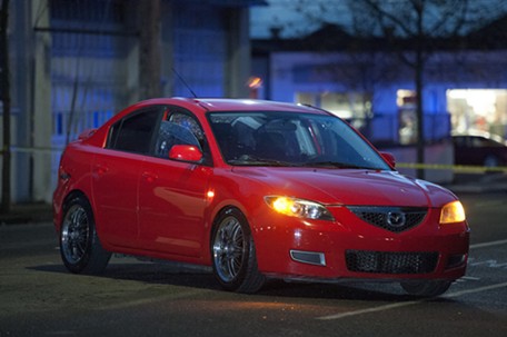 The red Mazda allegedly stolen from Sole Savers and abandoned about a block away. - MARK MCKENNA