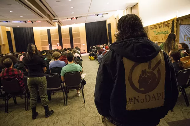 Erik Rydberg wearing a jacket that reads "#NoDAPL" at the Jill Stein discussion held at Humboldt State University on March 8. - SAM ARMANINO