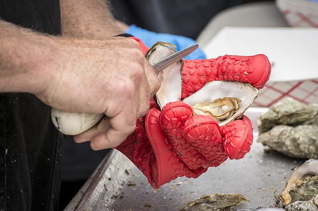 Tens of thousands of locally produced oysters met their fate at the 27th annual Oyster Festival. - PHOTO BY MARK LARSON
