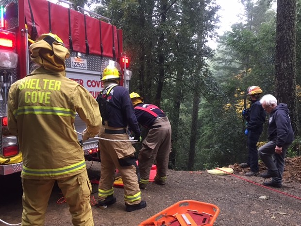 Volunteer firefighters at the scene of this morning's crash on Chemise Mountain Road off Shelter Cove Road. - COURTESY OF SHELTER COVE FIRE DEPARTMENT