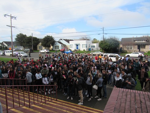 More than 100 students walked out of Eureka High School and gathered on the front steps. - LINDA STANSBERRY