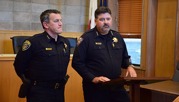 Former Arcata Police Chief Tom Chapman, right, at a press conference with University Police Chief Donn Peterson last year. - THADEUS GREENSON