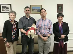 From left to right: Marie Escher, special agents Dave Keller and Joe Hong, and Diane Johnson at the March turnover. - SUBMITTED