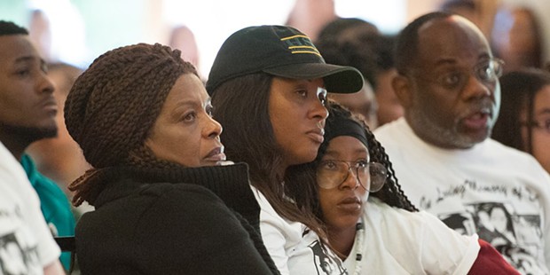 Josiah Lawson's mother, Charmaine, and grandmother listen to a speaker at her son's 2017 memorial service. - FILE PHOTO