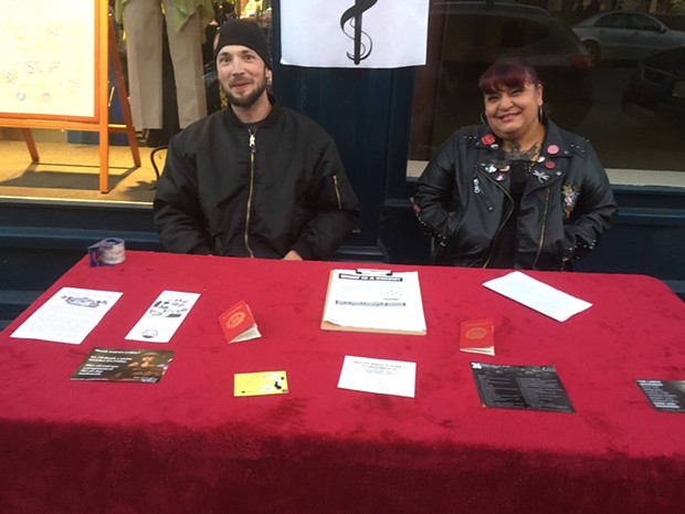 Nathan Irvine and Rachel Montoya table for IWW. - SUBMITTED