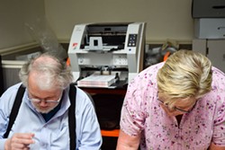 Volunteers Wes Rishel and Carolyn Crnich scan ballots for the Elections Transparency Project. - PHOTO BY THADEUS GREENSON