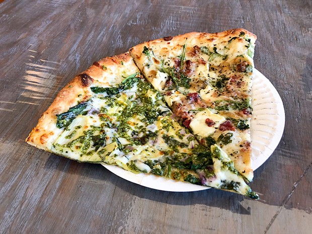 Pizza with pesto and brie in Trinidad.