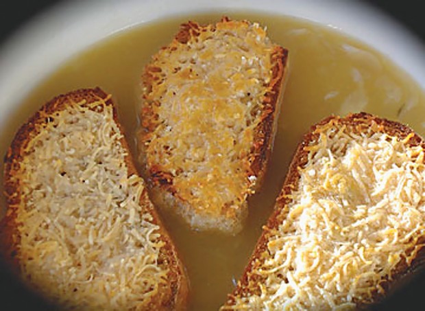 Rye toasts and "snappy" Parmesan atop onion soup are a pleasure, even in hard times.