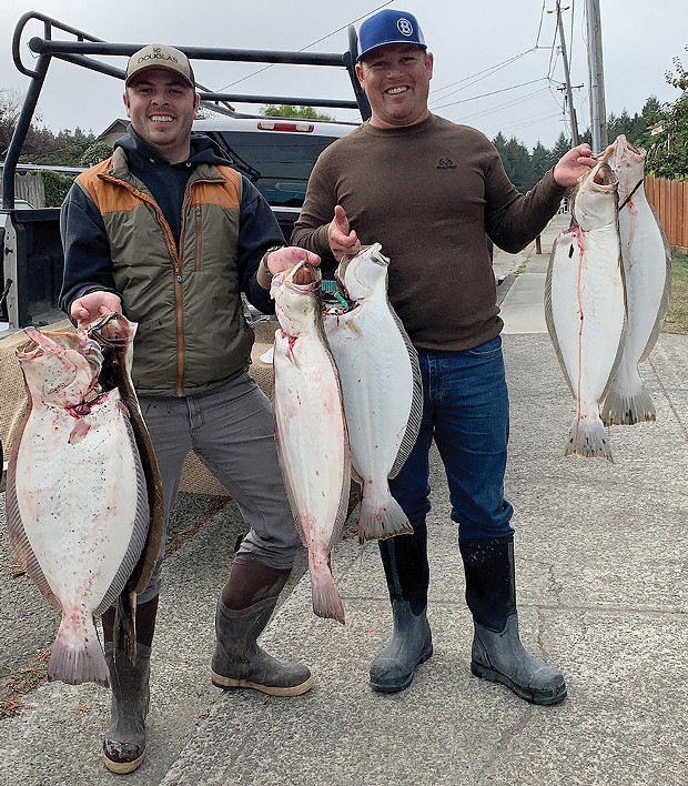 Tyler Gillespie, left, along with Russell Boham scored limits of California halibut last week while fishing in Humboldt Bay.
