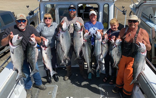 A group of anglers are all smiles after boating limits of king salmon while fishing out of Shelter Cove last week.