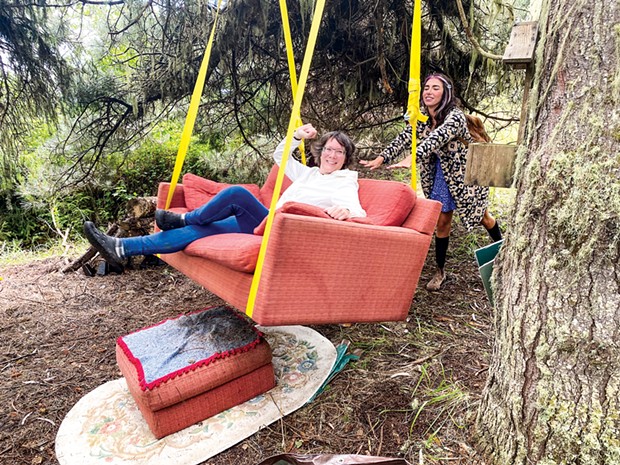 Visitors swing on Gretchen Schuster's love seat and love letter-writing station.