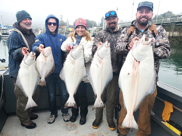 Customers of Brookings Fishing Charters hold Pacific halibut caught last week, despite rough, choppy water. They were fishing with Capt. Mick Thomas aboard the Dash.