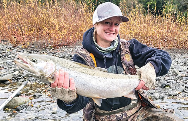 Amber Bray of Brookings, Oregon, landed an early-arriving hatchery steelhead while fishing the Chetco River Monday.