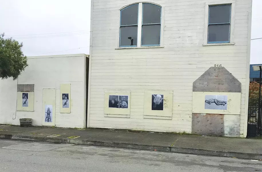 The wheatpasted black and white copies of Weidel's original Heroin Hilton images. - PHOTO BY JESSE WIEDEL
