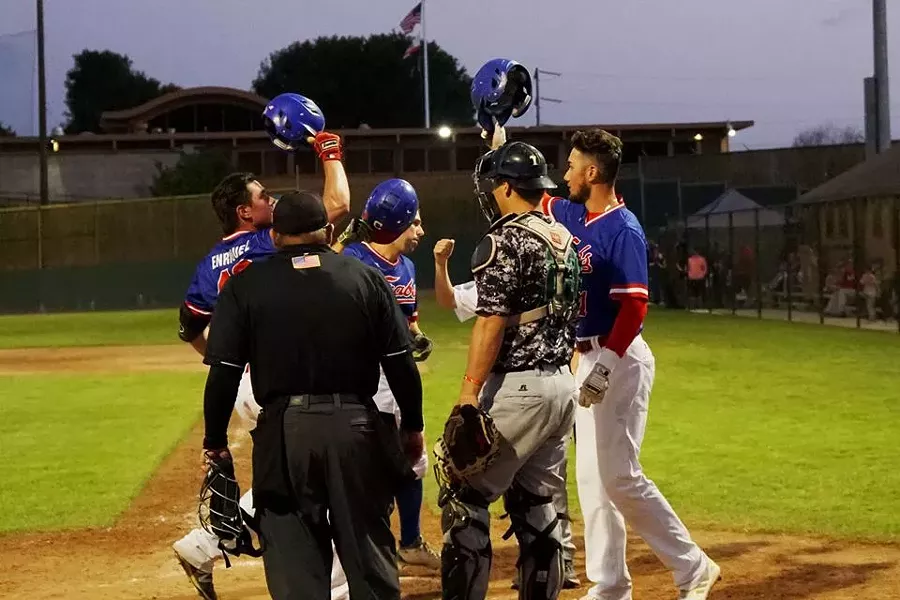 First baseman Ramon Enriquez celebrates a home run - MATT FILAR