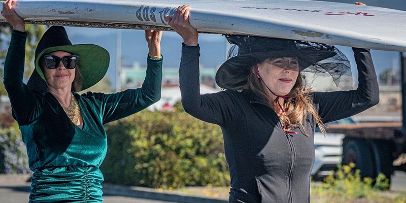 3rd annual Witches Paddle 2022 With the decison finally made to go paddle, event organizer Jody Himango and Patty Costanza, of Eureka, unload one of their stand-up paddle boards and head for the boat ramp at the Eureka Public Marina. Photo by Mark Larson
