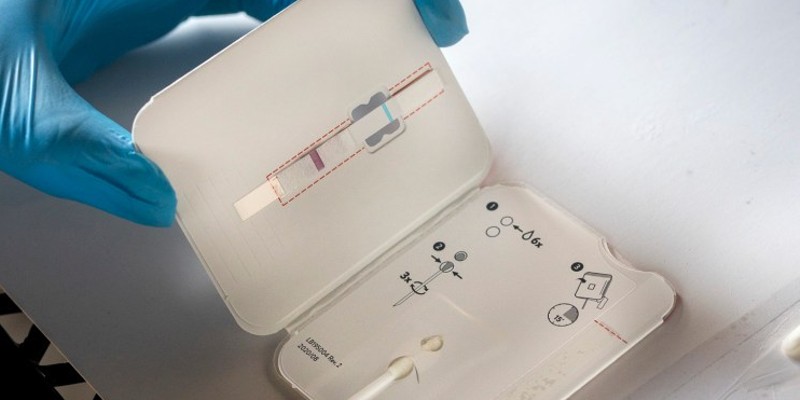 A rapid antigen COVID-19 test is used on patients at Canal Alliance’s test site in San Rafael.