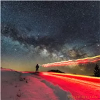 On Feb. 21, 2018, the Galactic Core (I think of it in capitals) rose at 02:57AM, appearing just a little south of east. By 05:00 when I photographed it, it was 18º above the horizon, and the dawn would soon chase it away. The streaks of light in this self portrait are from my light as I walked up the hill during the exposure.