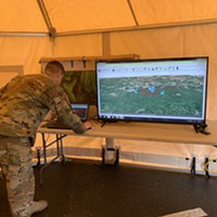 National Guard Staff Sgt. Alan Clark out of Sacramento uses the Nano computer, which uses satellite technology to track search and rescue crews looking for the Carrico sisters.