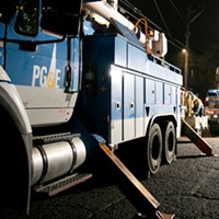 PG&E employees work to replace a nearly 100-year-old utility pole in Berkeley last year.
