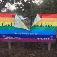 The words “God is still speaking” are obscured after the United Congregational Christian Church’s rainbow flag was destroyed this week.