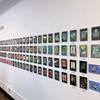 The wall of more than 270 cards on display for The Card Show at Epitome Gallery.