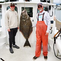 Cooper Sharp, of Lewiston (left), landed a monster 97.5-pound Pacific halibut Sunday while fishing out of Eureka with Eric Justesen (right).