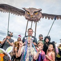 A last-minute shopping trip replaced the forgotten-at-home wing supports and this owl finally soared over Saturday's All Species Parade during the North Country Fair.