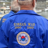 Korean War veteran Warren Longnickel, 83, of Carlotta and fellow veteran Don Biasca head down the dock to board the U.S. Coast Guard cutter Dorado for the commemorative wreath ceremony. U.S. involvement in the “Korean conflict” ended in 1953.