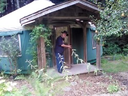 PHOTO BY TRUDY THOMAS - Welcome to a year in the yurt. Steven Saint Thomas shows off the abode.