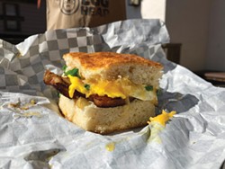 PHOTO BY JENNIFER FUMIKO CAHILL - The Egghead PB&amp;J, pork belly, egg and onion jam on a biscuit.