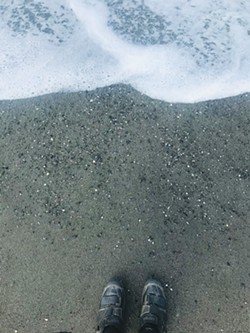 PHOTO BY HOLLIE ERNEST - Feet on the sand, contemplating the journey ahead