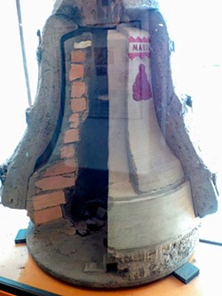 PHOTO BY BARRY EVANS - A cutaway model of a bell casting on display at the 418-year-old Grassmayr Glockengiesserei (bell foundry) in Innsbruck, Austria. The dark cavity between the brick-and-clay inner form and the outer clay casing is the mold for molten bronze.