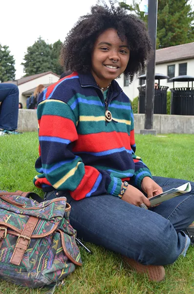 Zendrea, a freshman in zoology, hails from Santa Cruz and loves the open spaces and redwood trees up here. She's pairing her bright sweater from the Bargain Barn with a quartz necklace she got as a gift. - PHOTO BY SHARON RUCHTE