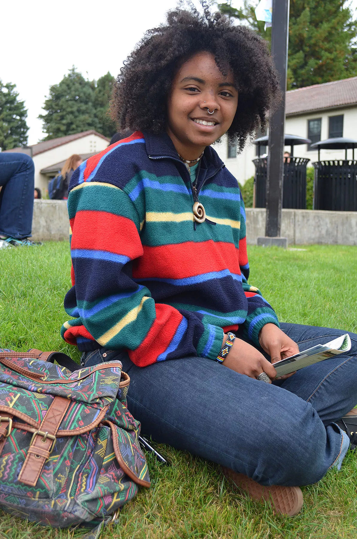 Zendrea, a freshman in zoology, hails from Santa Cruz and loves the open spaces and redwood trees up here. She's pairing her bright sweater from the Bargain Barn with a quartz necklace she got as a gift. - PHOTO BY SHARON RUCHTE