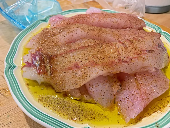 SEASONED EATING Pasolivo tangerine olive oil and Tony Chachere's Creole Seasoning give the rockfish and kick of heat and a citrus backbone. - PHOTO BY CAMILLIA LANHAM