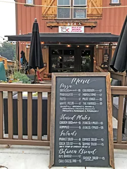 MAIN STREET U.S.A. On Main Street in Templeton is the wine stop for local winemakers and wine biz folk, but it also is a casual, relaxing place to enjoy beautiful cheese boards and nibbles, authentic Italian pizza and pasta, and salads. - PHOTOS BY BETH GIUFFRE