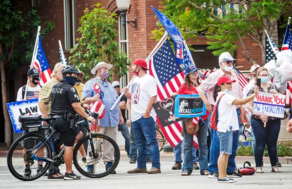 SUPPORTING BLUE On Aug. 25, counter-protesters called for "law and order," demanding Arata pay the time for her crimes and remained firm on their support for law enforcement. - PHOTOS BY JAYSON MELLOM