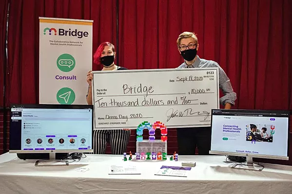 STARTUP SUCCESS Entrepreneurs behind the startup Bridge hold up their $10,000 check that the Cal Poly Center for Innovation and Entrepreneurship provides to eight teams each year through its HotHouse Summer Accelerator program. - PHOTO COURTESY OF MIRANDA KNIGHT