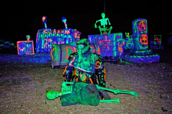 THE LIVING DEAD A "zombie" is poised on the field at Gladiator Paintball Park's Zombie Hunt on Oct. 3. Zombies will be available for hunting every weekend in October. - PHOTO BY JAYSON MELLOM