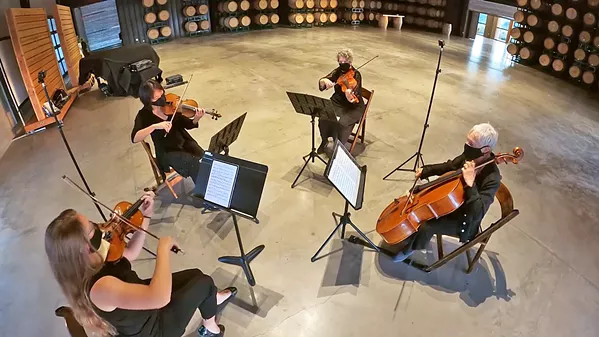NO AUDIENCE SLO Symphony musicians (clockwise from bottom left, Emily Lanzone, Grace Seng, Karen Loewi Jones, and Barbara Hunter) record a private performance of Beethoven's String Quartet No. 4 at Cass Winery's barrel room. - PHOTO COURTESY OF THE SLO SYMPHONY