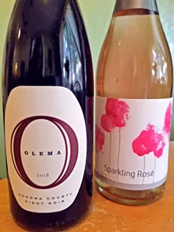 GLOBAL SHIPMENT The 2018 pinot noir from Olema in Sonoma County and the 2018 Huber sparkling rose from Austria were just two of the 12 bottles included in October's SLO Wine and Beer Co. wine club shipment. - PHOTO BY ANDREA ROOKS