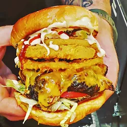 ANOTHER OPTION Chef Bonetti likes to keep his non-chicken protein options fresh, serving changing pork and beef options like the Dr. Grizzly: A cola-braised brisket with lettuce, tomato, pickles, grizzly sauce, onion rings, cheddar, barbecue, and apple slaw. - PHOTOS COURTESY OF BRENEN BONETTI