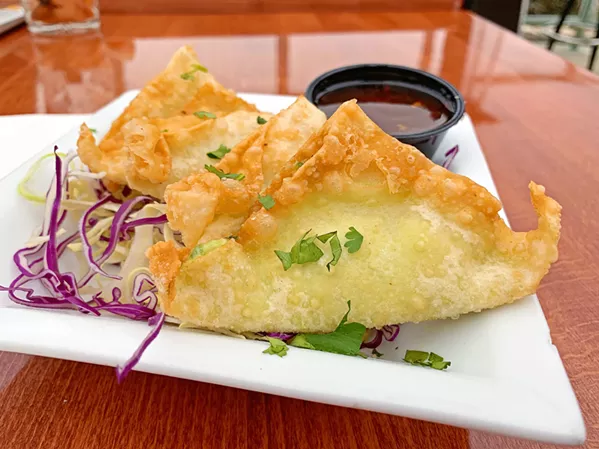 TWISTY Diced jalepeños and cream cheese wrapped in a wonton and deep fried is The Siren's twist on jalepeño poppers. - PHOTO BY CAMILLIA LANHAM