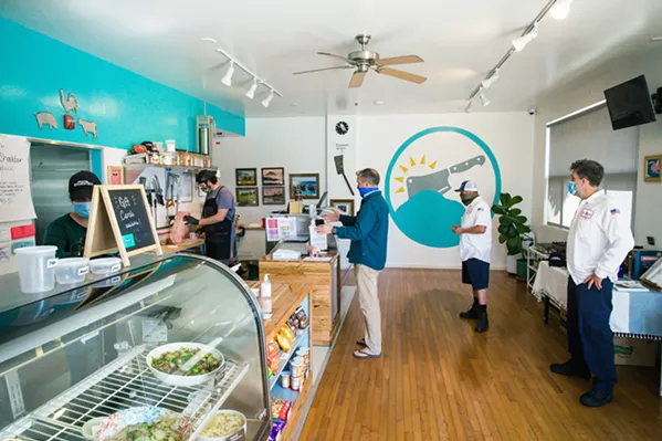 MEAT RUSH Customers wait their turn at the Morro Bay Butcher and Deli, which took over the building that used to house T.K.D. Surf Shop. - PHOTOS BY JAYSON MELLOM