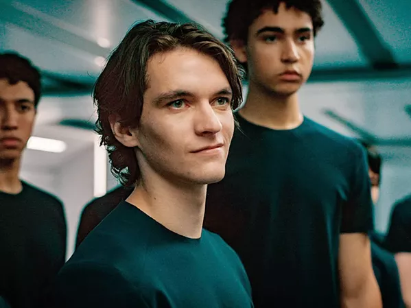 MADNESS Zac (Fionn Whitehead, center), one of 30 crew members on an 86-year-long space voyage, goes power mad, splitting the crew into warring tribes, in Voyagers, screening at Galaxy and Park. - PHOTO COURTESY OF AGC STUDIOS AND FIBONACCI FILMS